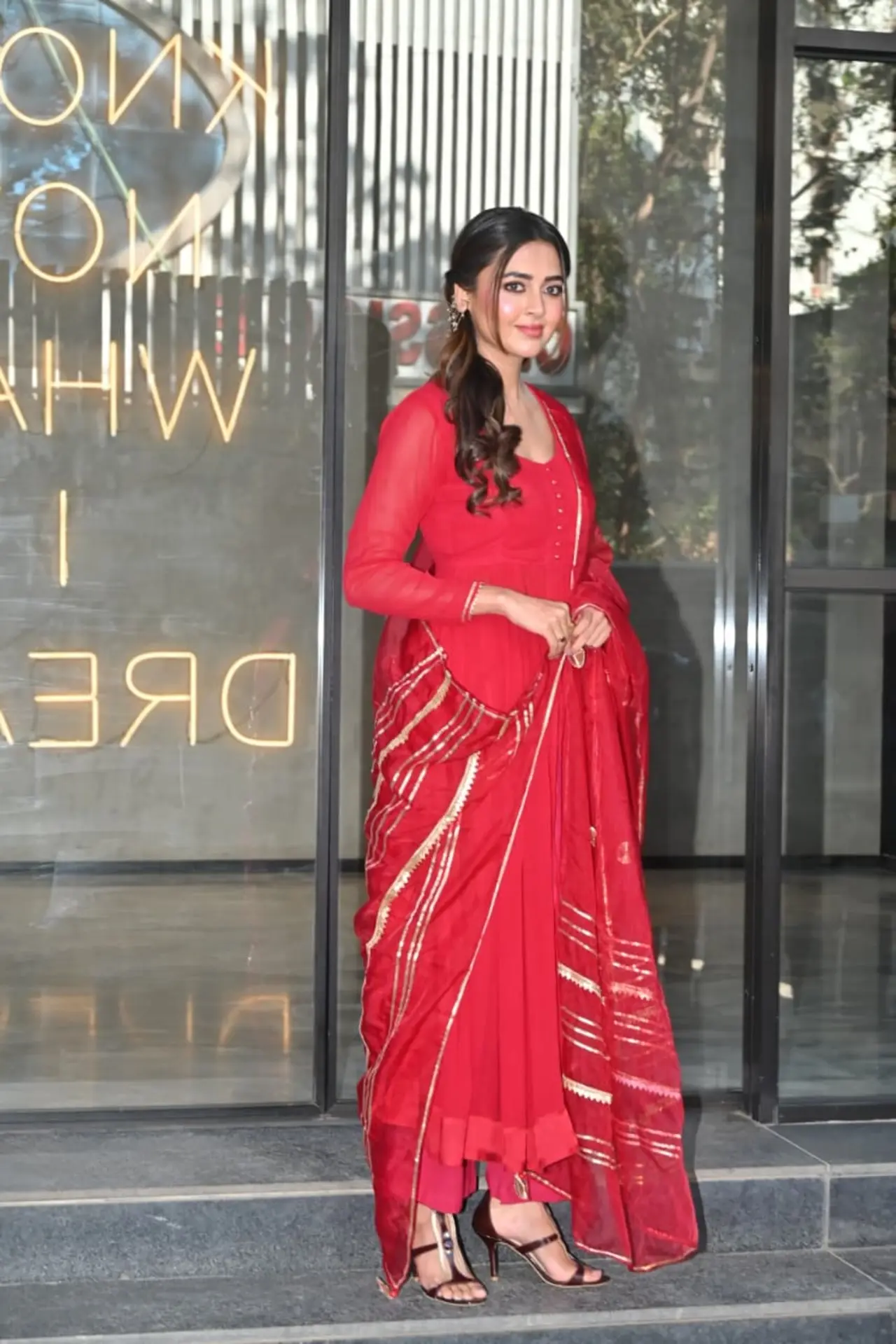 Tejasswi chose a red and gold anarkali for the occassion.